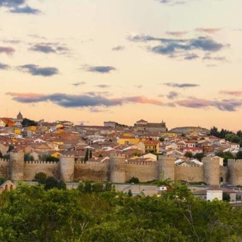 Walls of Medieval city of Avila at sunset, Spain